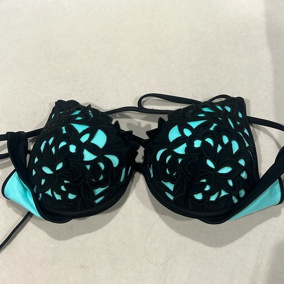 teal bathing suit with black designs on cup criss cross back with black strings - Picture 1 of 4